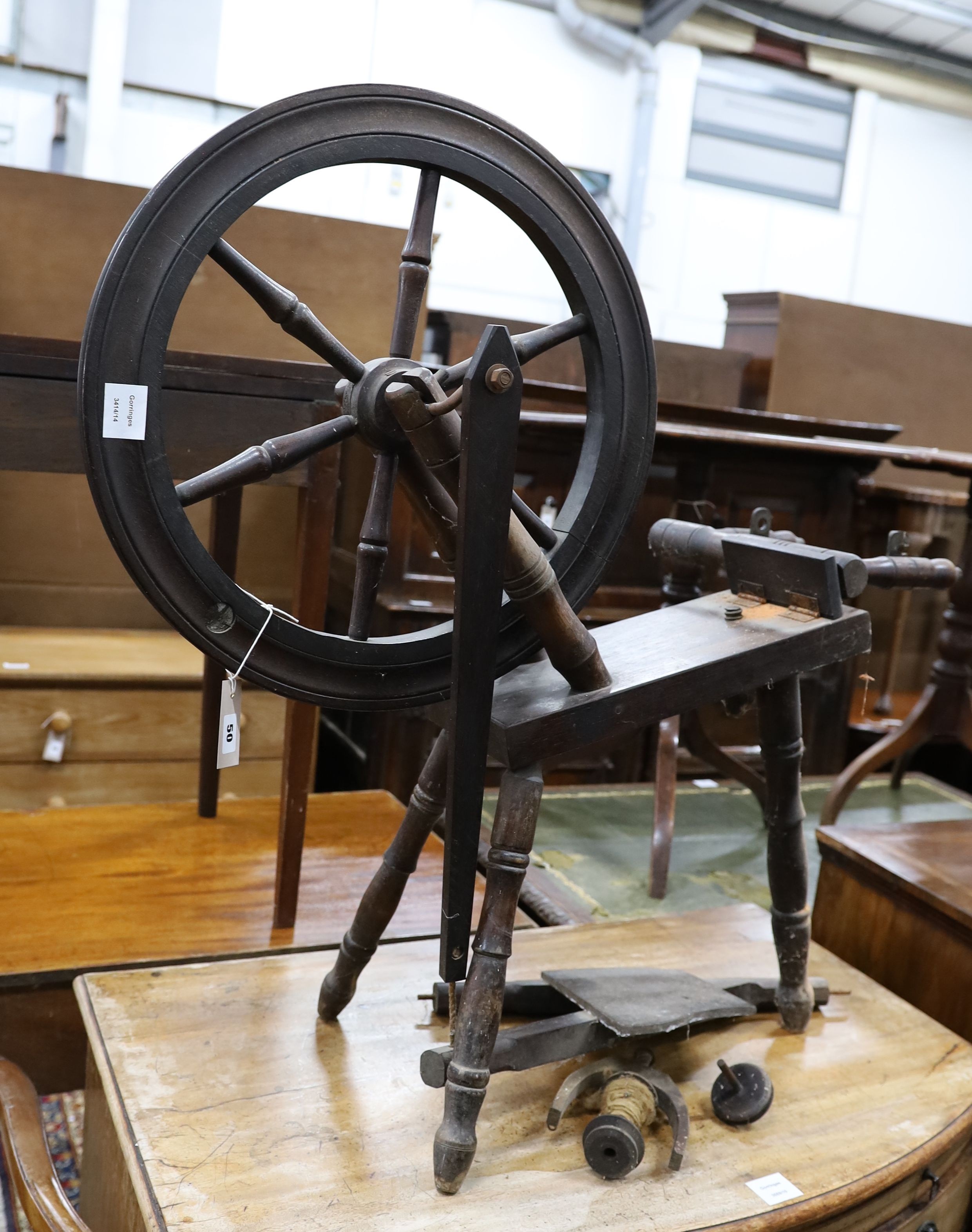 A reproduction spinning wheel, height 90cm